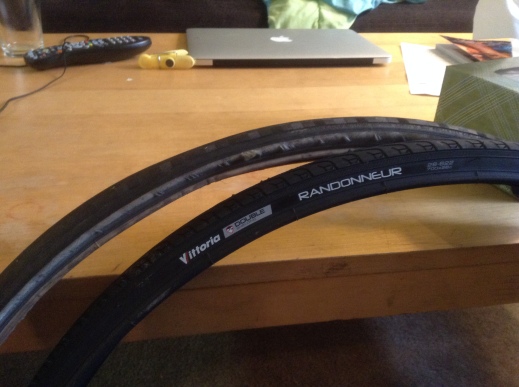 My old bike tire is behind the new one.